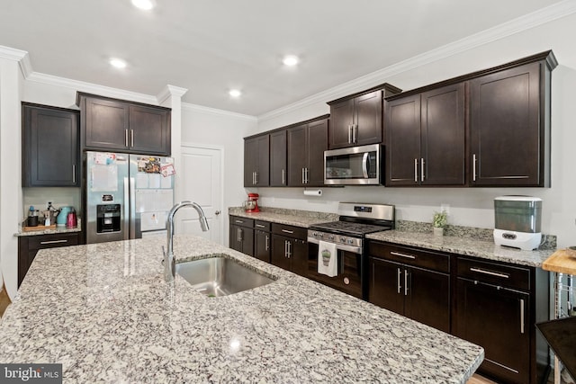 251 Rock Raymond Dr, Stafford, VA 22554 - kitchen with stainless steel appliances, a sink, dark brown cabinetry, ornamental molding, and light stone counters
