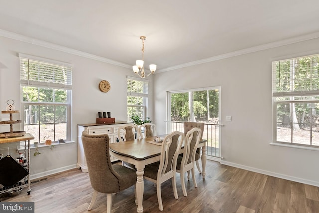 251 Rock Raymond Dr, Stafford, VA 22554 - dining space featuring a chandelier, light wood-type flooring, ornamental molding, and baseboards