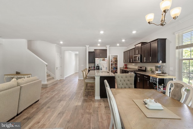 251 Rock Raymond Dr, Stafford, VA 22554 - dining room with crown molding, stairs, light wood finished floors, a chandelier, and recessed lighting