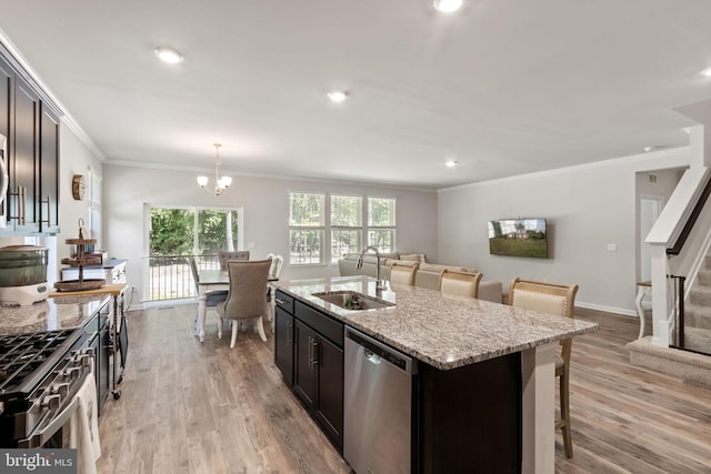 251 Rock Raymond Dr, Stafford, VA 22554 - kitchen with appliances with stainless steel finishes, a sink, crown molding, light wood finished floors, and light stone countertops