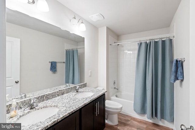 251 Rock Raymond Dr, Stafford, VA 22554 - full bathroom with wood finished floors, double vanity, shower / tub combo, and toilet