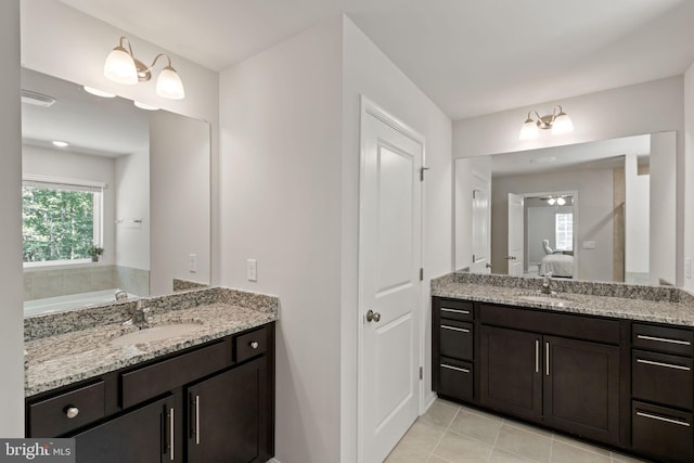 251 Rock Raymond Dr, Stafford, VA 22554 - full bathroom featuring vanity, ensuite bathroom, a tub to relax in, and tile patterned floors