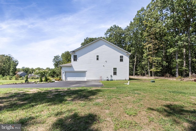 251 Rock Raymond Dr, Stafford, VA 22554 - view of home's exterior featuring an attached garage, driveway, and a lawn