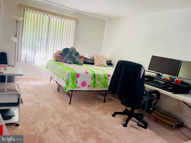 9707 Kings Crown Ct Unit 101, Fairfax, VA 22031 - carpeted bedroom with a desk