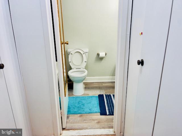 9707 Kings Crown Ct Unit 101, Fairfax, VA 22031 - bathroom featuring wood finished floors and toilet