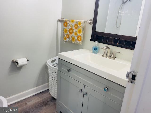 9707 Kings Crown Ct Unit 101, Fairfax, VA 22031 - bathroom featuring vanity and wood finished floors