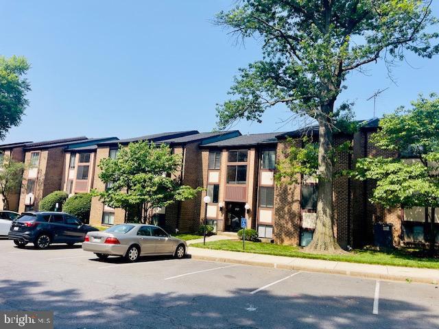 9707 Kings Crown Ct Unit 101, Fairfax, VA 22031 - view of building exterior featuring uncovered parking