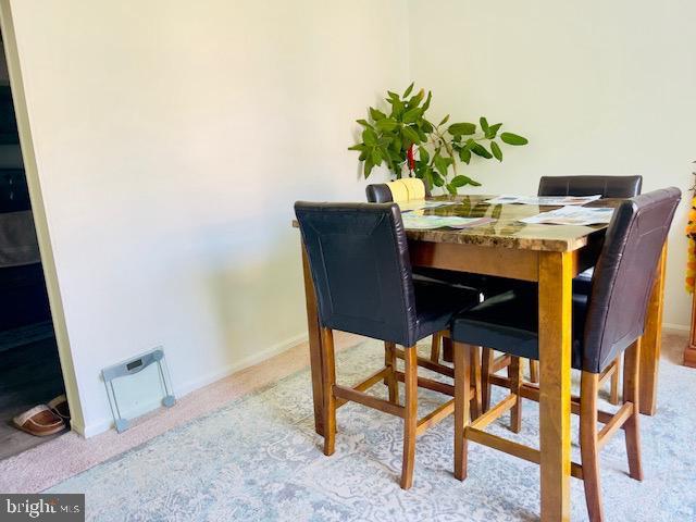 9707 Kings Crown Ct Unit 101, Fairfax, VA 22031 - carpeted dining room with baseboards