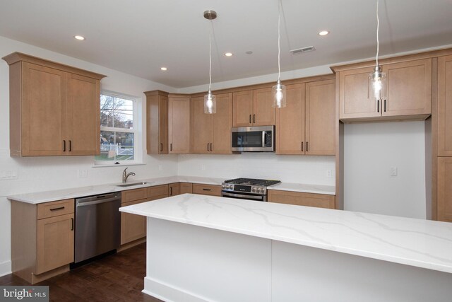 404 E 7th Ave Lot 3, Conshohocken, PA 19428 - kitchen featuring stainless steel appliances, a sink, light stone countertops, dark wood-style flooring, and hanging light fixtures
