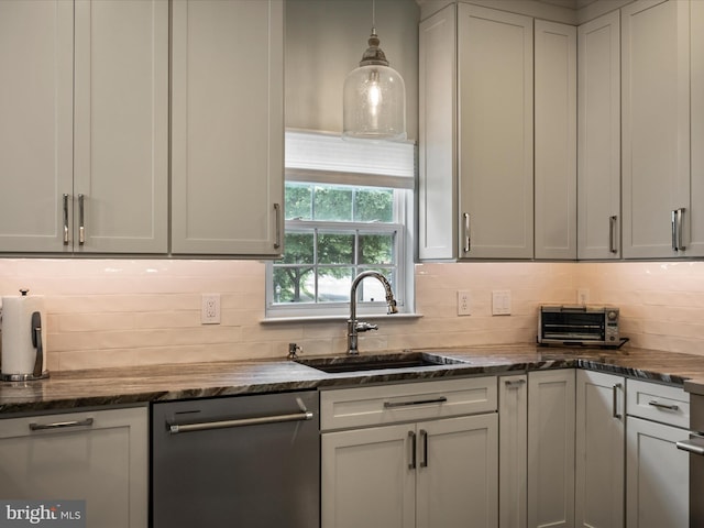 21526 Golden Autumn Pl, Broadlands, VA 20148 - kitchen with stainless steel dishwasher, tasteful backsplash, dark stone counters, and hanging light fixtures