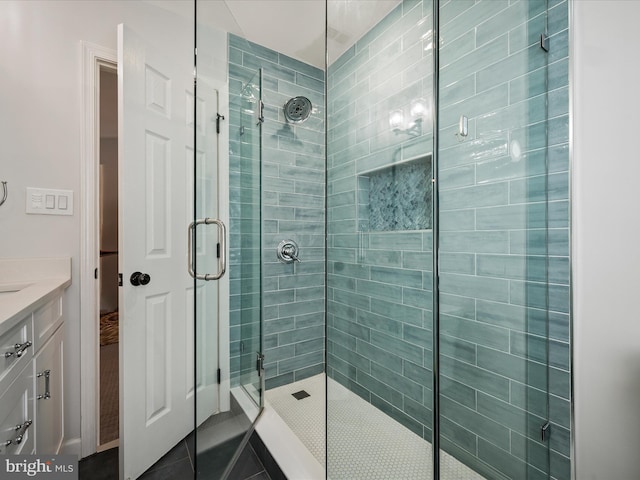 21526 Golden Autumn Pl, Broadlands, VA 20148 - bathroom with a stall shower, vanity, and tile patterned floors