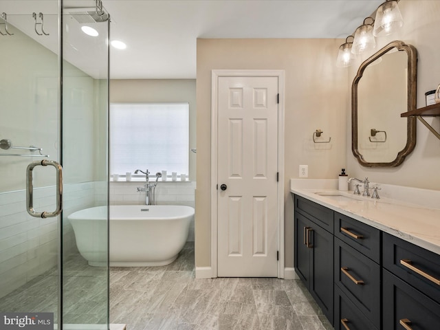 21526 Golden Autumn Pl, Broadlands, VA 20148 - full bath featuring vanity, a freestanding tub, and a stall shower