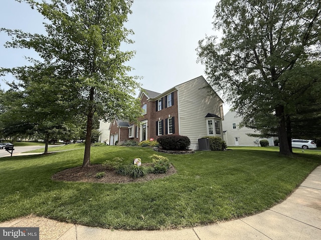 21526 Golden Autumn Pl, Broadlands, VA 20148 - view of home's exterior featuring a yard and brick siding