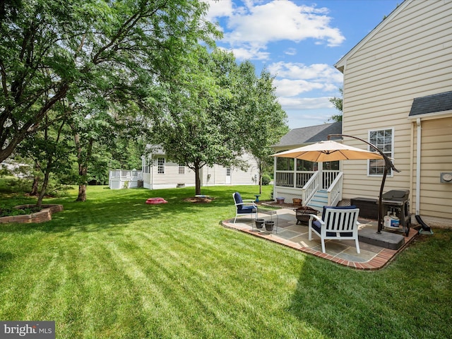 21526 Golden Autumn Pl, Broadlands, VA 20148 - view of grassy yard featuring a patio