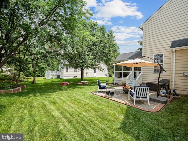 21526 Golden Autumn Pl, Broadlands, VA 20148 - view of grassy yard featuring a patio