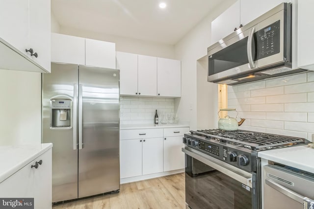 309 Bayview Rd, Edgewater, MD 21037 - kitchen featuring stainless steel appliances, tasteful backsplash, light countertops, and white cabinets