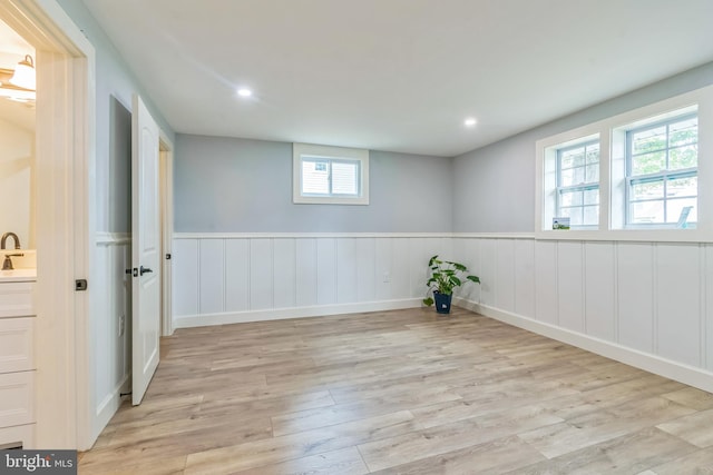 309 Bayview Rd, Edgewater, MD 21037 - empty room featuring light wood-type flooring, wainscoting, recessed lighting, and a sink