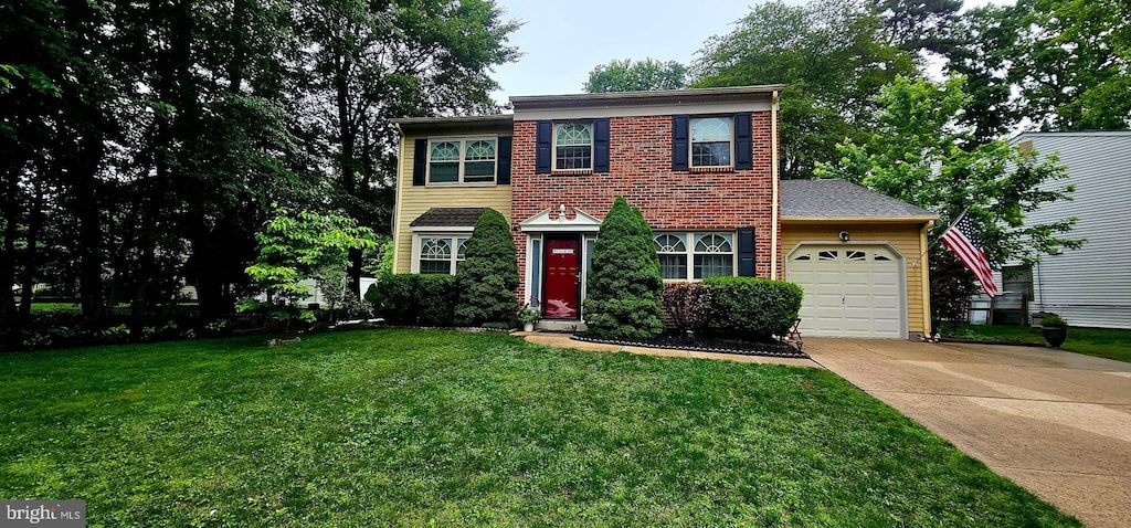 59 Lakeside Dr, Marlton, NJ 08053 - view of front of home featuring an attached garage, concrete driveway, and a front yard