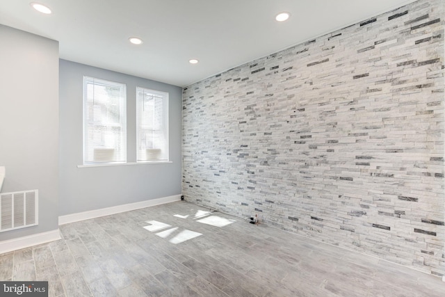 2915 Baker St, Baltimore, MD 21216 - empty room with baseboards, recessed lighting, wood finished floors, and an accent wall