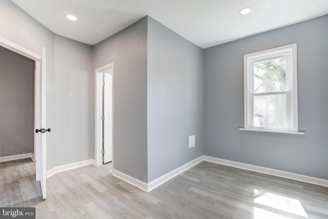 2915 Baker St, Baltimore, MD 21216 - spare room featuring wood finished floors, baseboards, and recessed lighting