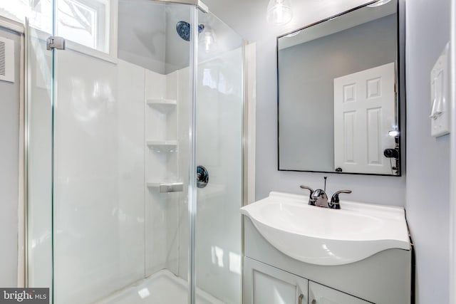 2915 Baker St, Baltimore, MD 21216 - bathroom featuring a shower stall and vanity