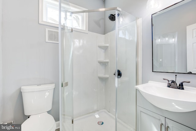 2915 Baker St, Baltimore, MD 21216 - full bath featuring vanity, a stall shower, and toilet