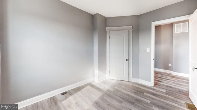 2915 Baker St, Baltimore, MD 21216 - unfurnished room with wood finished floors and baseboards