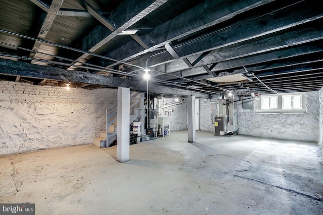 2915 Baker St, Baltimore, MD 21216 - basement with stairs, heating unit, and gas water heater