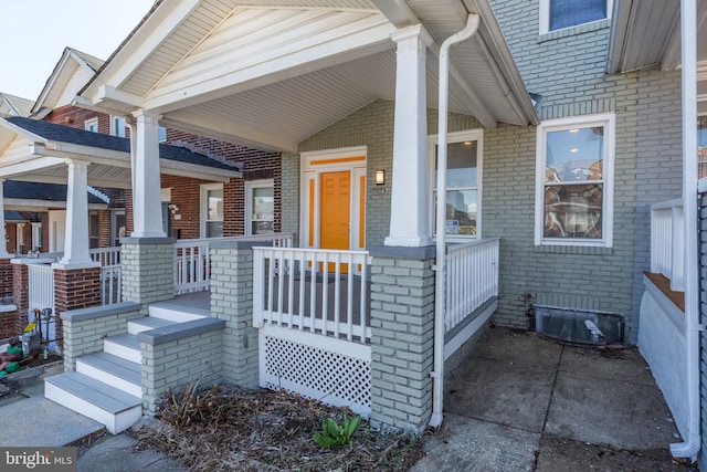 2915 Baker St, Baltimore, MD 21216 - property entrance featuring a porch and brick siding
