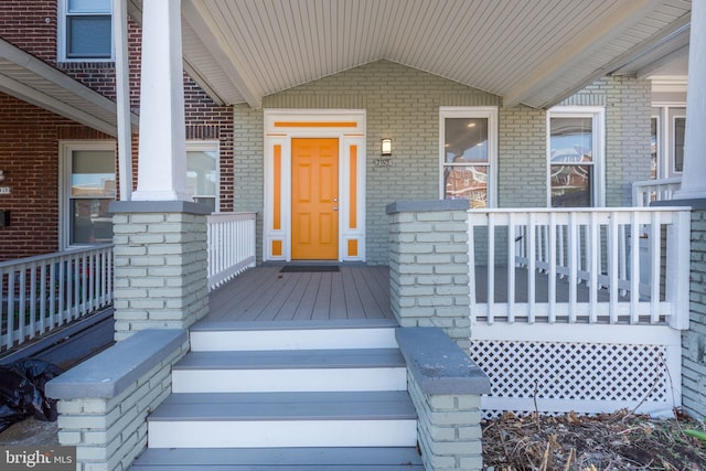 2915 Baker St, Baltimore, MD 21216 - property entrance featuring covered porch and brick siding