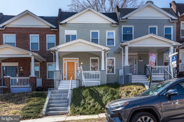 2915 Baker St, Baltimore, MD 21216 - multi unit property featuring a porch and brick siding