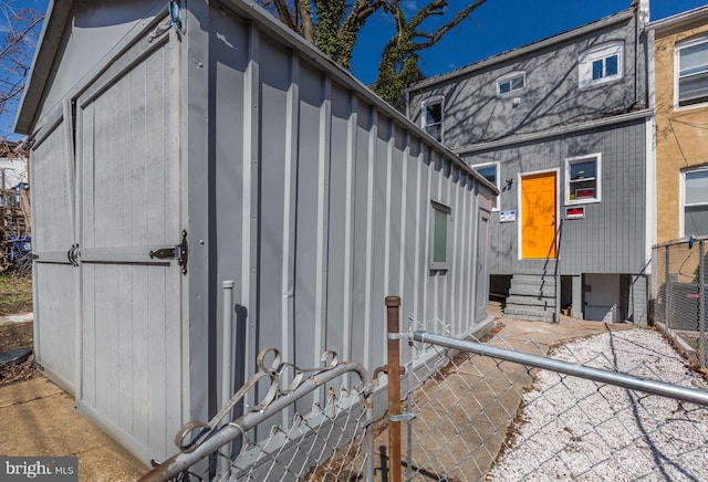 2915 Baker St, Baltimore, MD 21216 - view of side of home with entry steps and board and batten siding