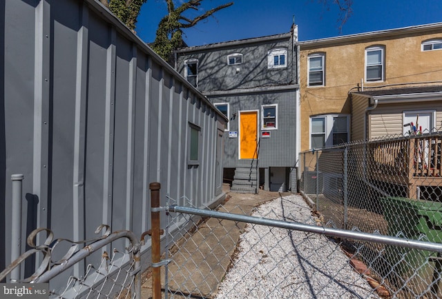 2915 Baker St, Baltimore, MD 21216 - rear view of house with entry steps and board and batten siding