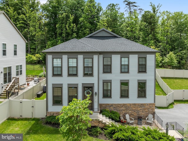 9929 Arapahoe Rd, New Market, MD 21774 - view of front of house with a gate, stone siding, and a shingled roof