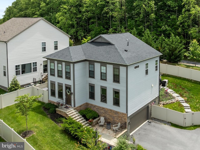 9929 Arapahoe Rd, New Market, MD 21774 - view of front of home featuring a shingled roof, a gate, driveway, and a garage