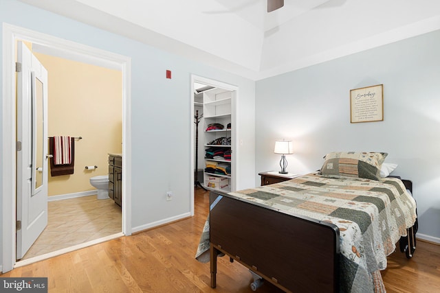 101 Colonial Downs Ct Unit 1305, Newark, DE 19702 - bedroom with a walk in closet, a closet, light wood-type flooring, and ensuite bath