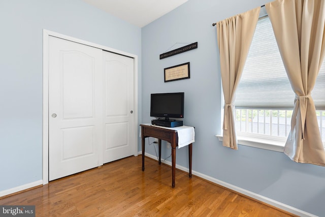 101 Colonial Downs Ct Unit 1305, Newark, DE 19702 - bedroom featuring baseboards, wood finished floors, and a closet