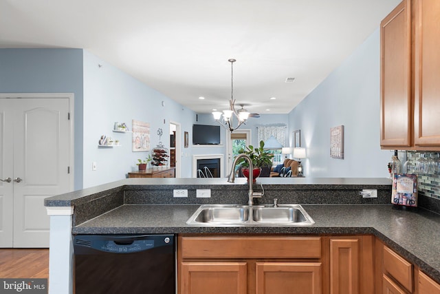 101 Colonial Downs Ct Unit 1305, Newark, DE 19702 - kitchen with dishwashing machine, a sink, dark countertops, open floor plan, and recessed lighting