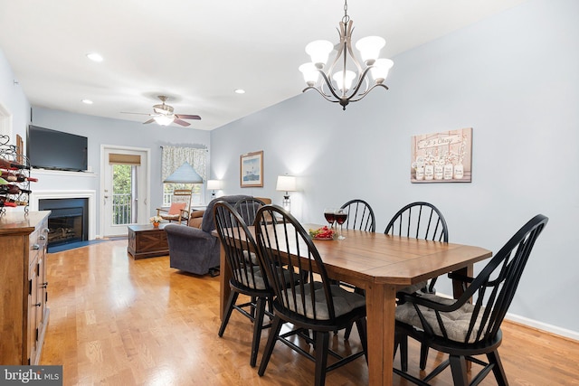 101 Colonial Downs Ct Unit 1305, Newark, DE 19702 - dining room featuring ceiling fan, light wood finished floors, a fireplace, a chandelier, and recessed lighting