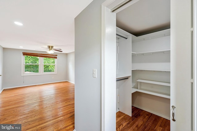 3414 Tyburn Tree Ct, Herndon, VA 20171 - spacious closet with a ceiling fan and wood finished floors