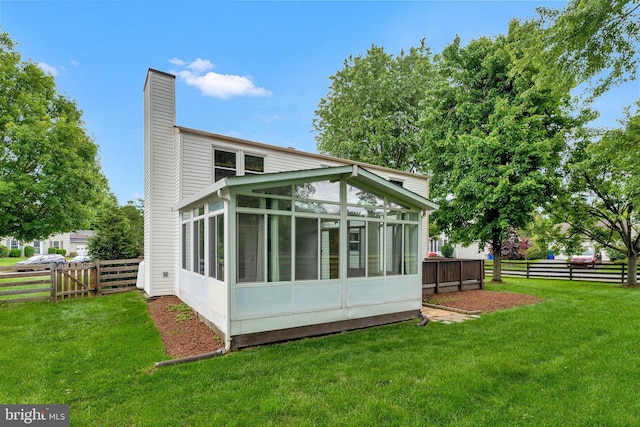 3414 Tyburn Tree Ct, Herndon, VA 20171 - rear view of property featuring a chimney and a sunroom