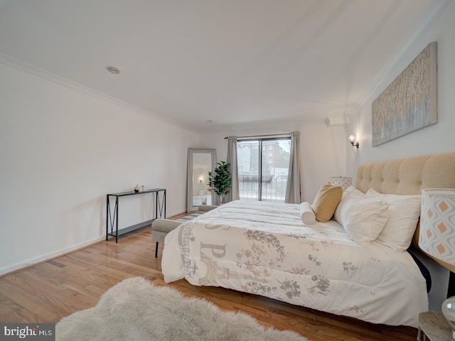 1715 15th St NW Unit 23, Washington, DC 20009 - bedroom with crown molding, wood finished floors, access to exterior, and baseboards