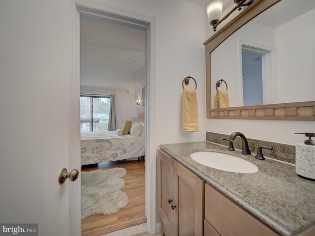 1715 15th St NW Unit 23, Washington, DC 20009 - bathroom with vanity, ensuite bath, and wood finished floors
