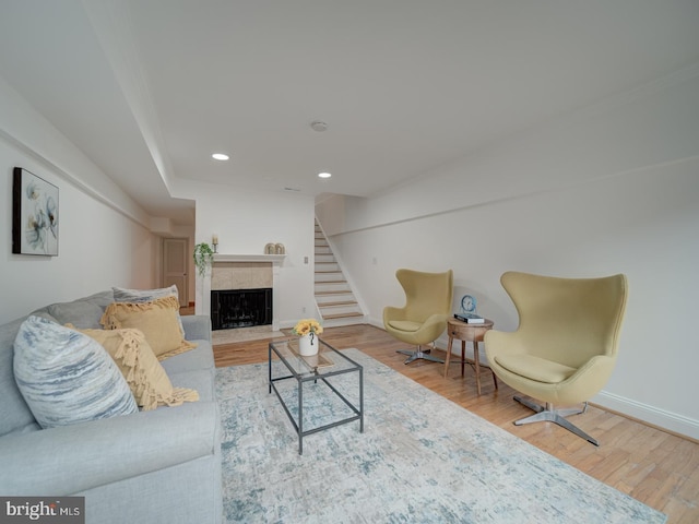 1715 15th St NW Unit 23, Washington, DC 20009 - living area with wood finished floors, a tile fireplace, recessed lighting, and baseboards