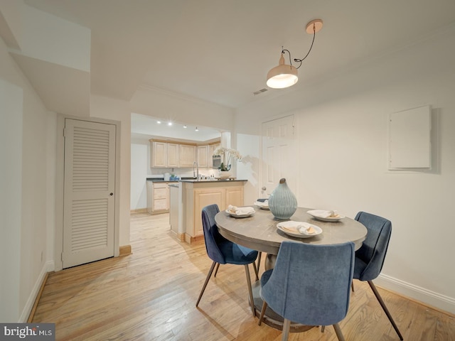 1715 15th St NW Unit 23, Washington, DC 20009 - dining room featuring baseboards and light wood-style floors