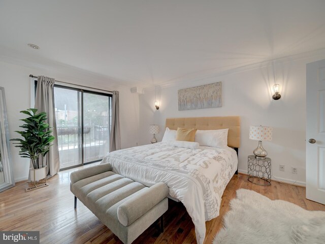 1715 15th St NW Unit 23, Washington, DC 20009 - bedroom featuring access to outside, wood finished floors, and baseboards