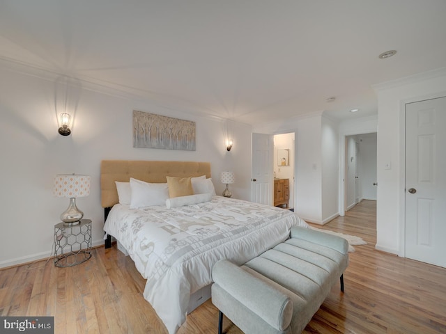 1715 15th St NW Unit 23, Washington, DC 20009 - bedroom featuring crown molding, light wood-style flooring, baseboards, recessed lighting, and ensuite bathroom