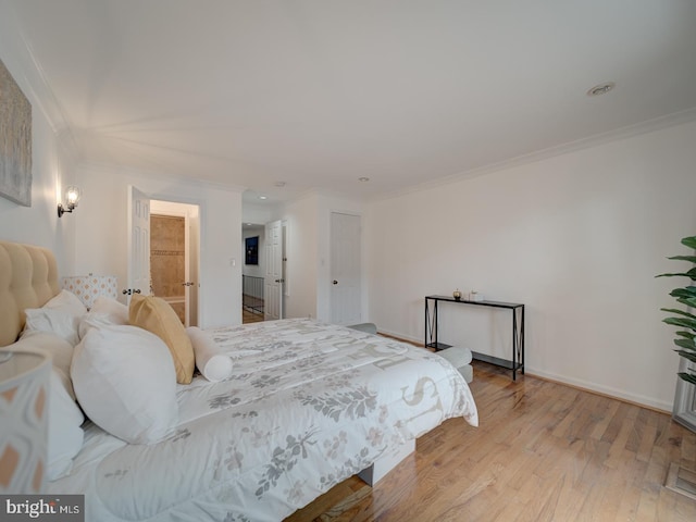 1715 15th St NW Unit 23, Washington, DC 20009 - bedroom with crown molding, light wood-type flooring, recessed lighting, and baseboards
