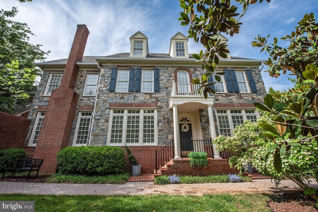 1496 Evans Farm Dr, Mclean, VA 22101 - colonial home featuring stone siding and a chimney