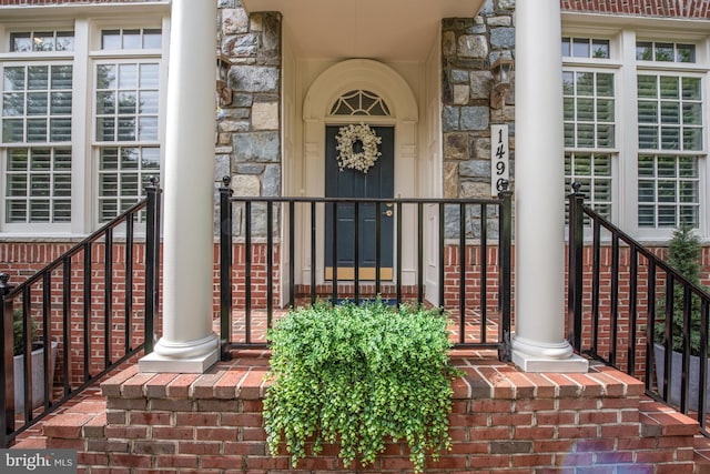 1496 Evans Farm Dr, Mclean, VA 22101 - doorway to property featuring stone siding and a porch